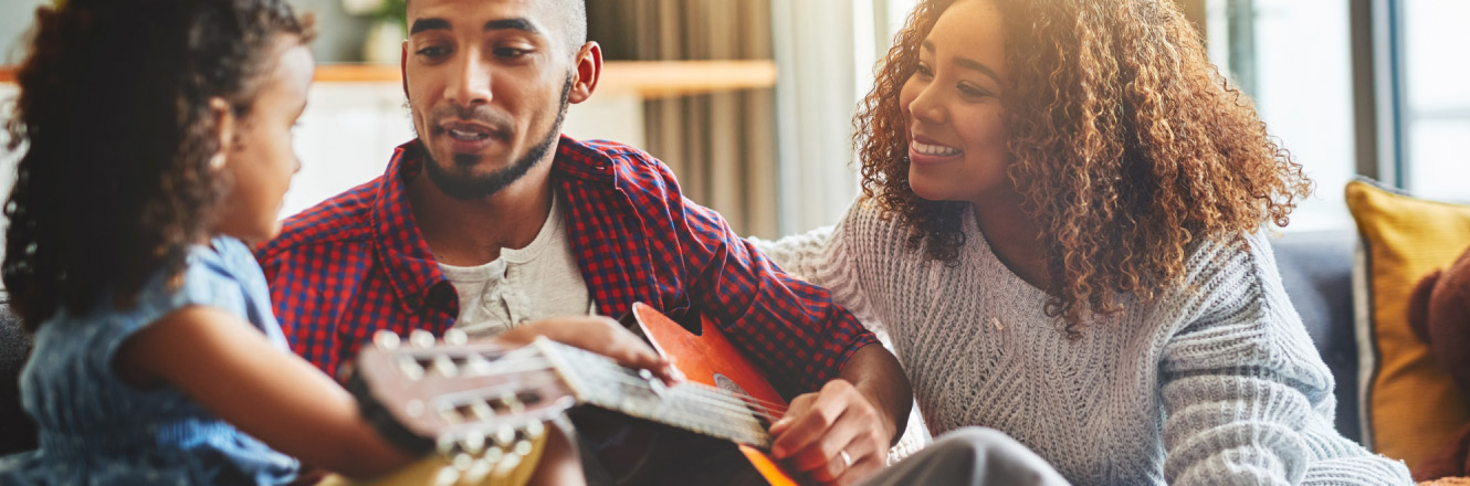 Family playing guitar