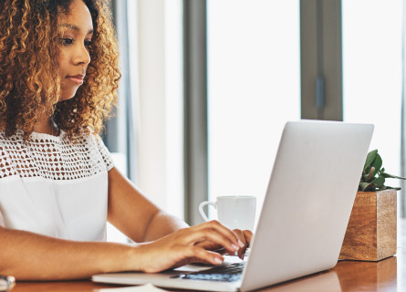 an individual working on their laptop