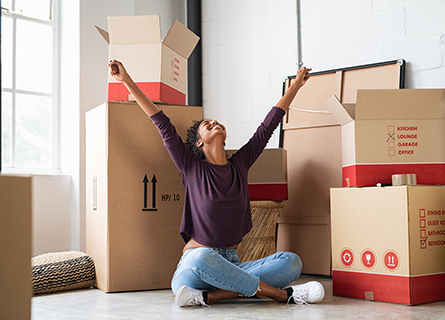 Happy young women and boxes