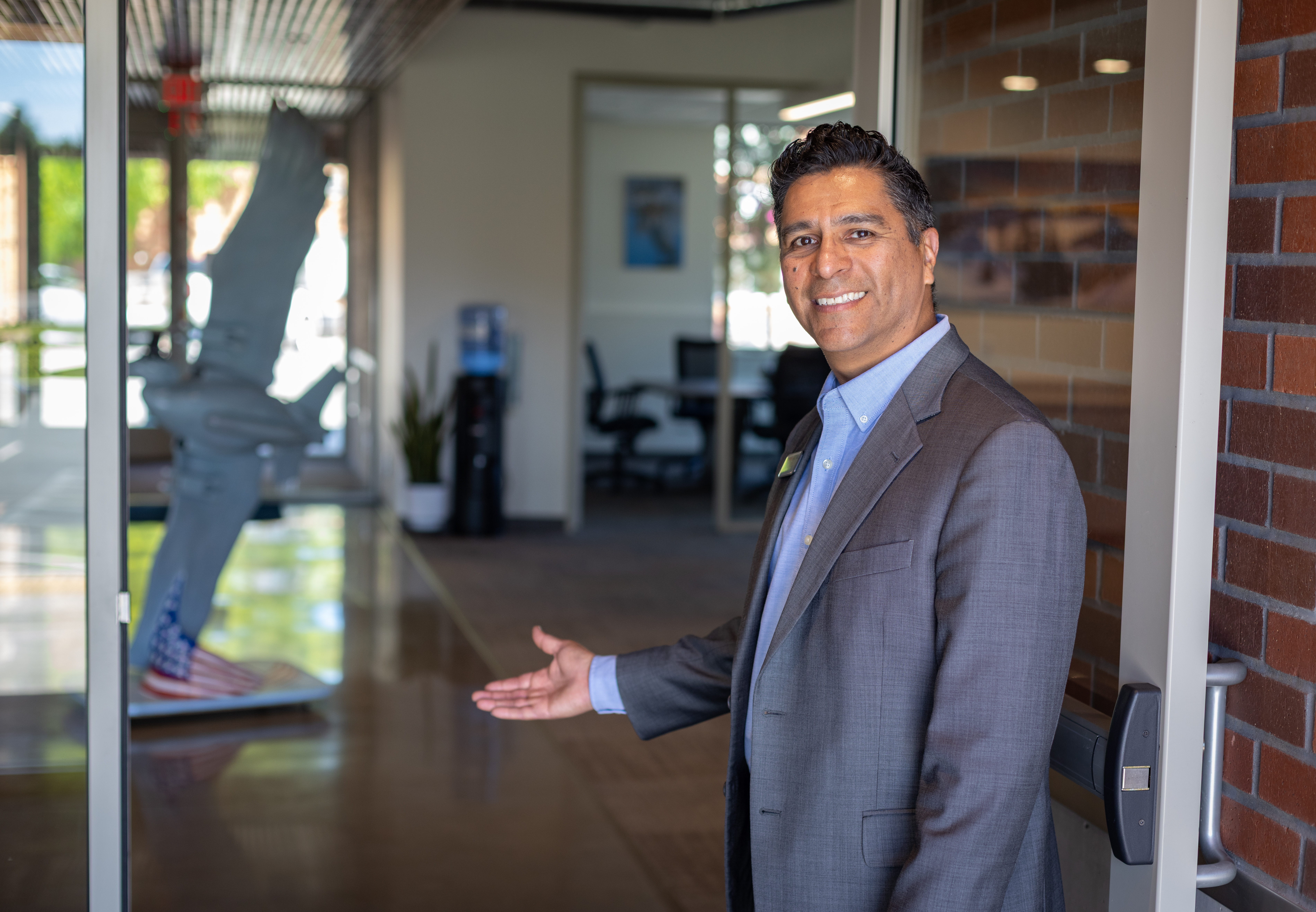 PBOC employee opening the door for customers.